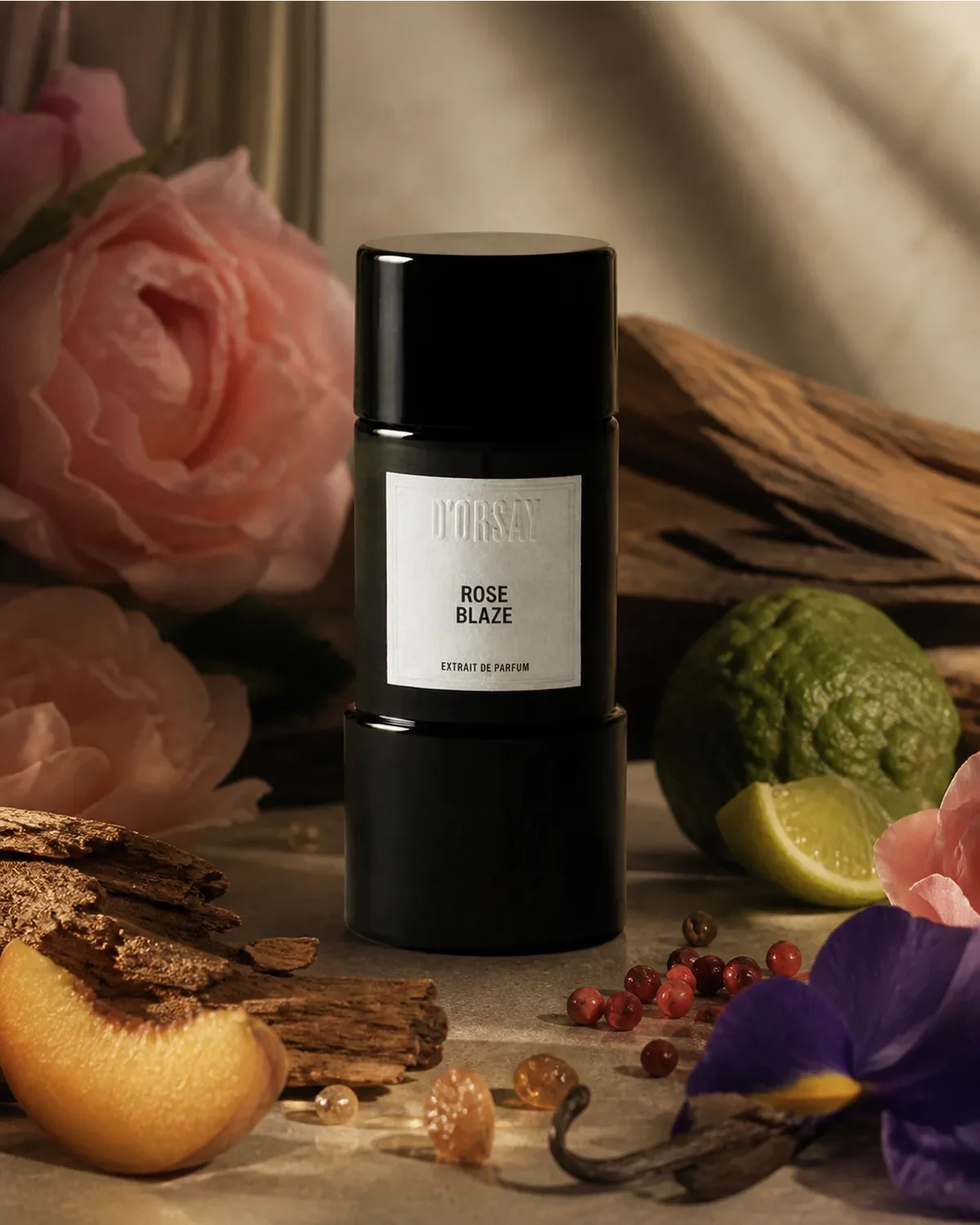 D’ORSAY ROSE BLAZE EXTRAIT DE PARFUM 90ml fragrance bottle in a scent-inspired setting